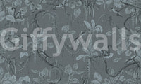 Jungle Sketch Blue Serenity wall mural shown as a full-wall slate-blue scene of monkeys among sketched tropical leaves and palms