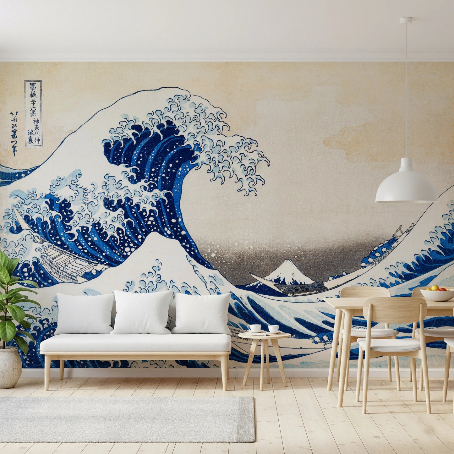 Katsushika Hokusai's The Great Wave off Kanagawa wallpaper mural of the blue wave behind a white bench sofa and wooden dining table