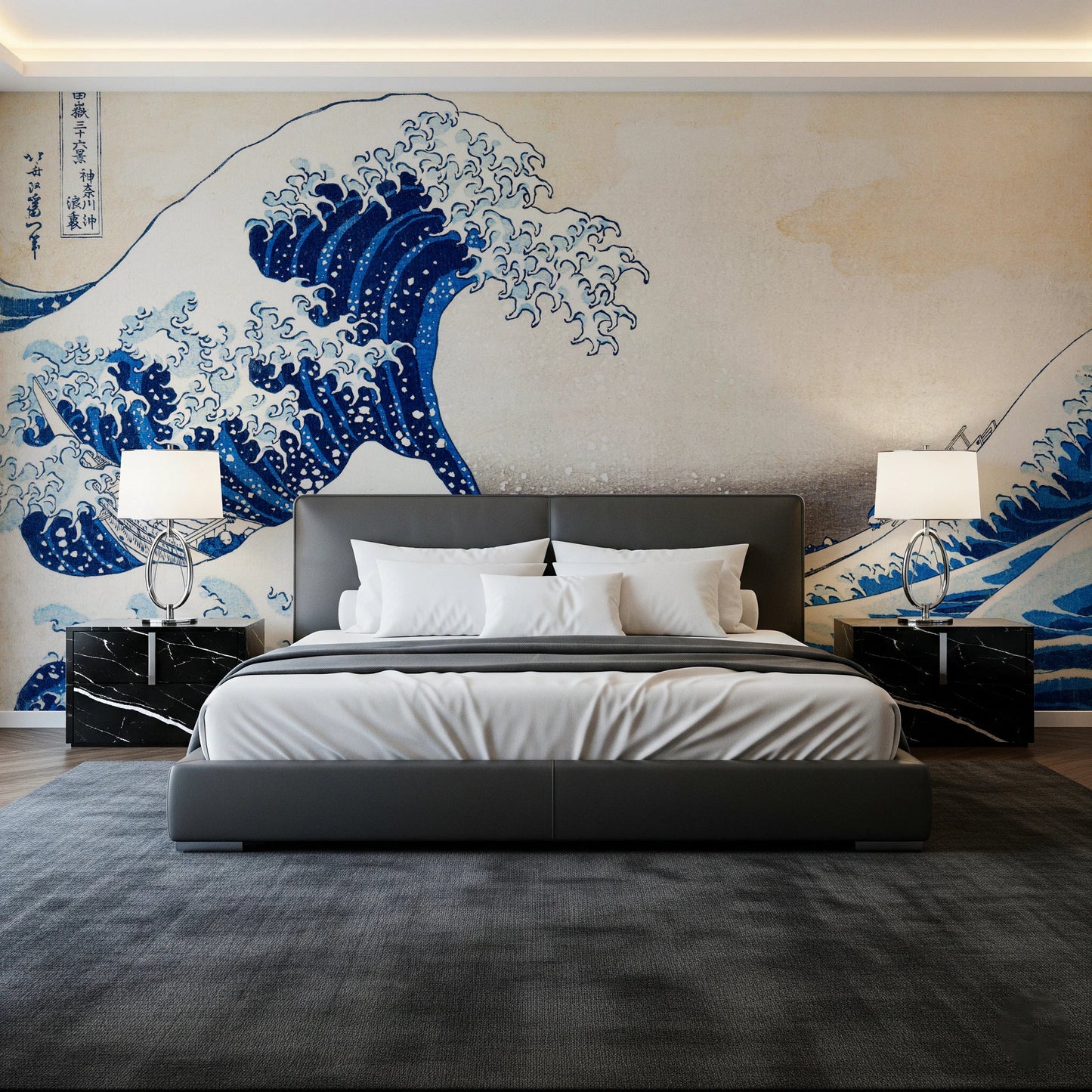 Katsushika Hokusai's The Great Wave off Kanagawa wallpaper mural with the blue wave above a grey bed and black marble nightstands in a bedroom