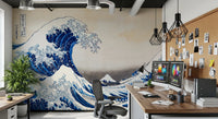 Katsushika Hokusai's The Great Wave off Kanagawa wallpaper mural with the blue wave behind a home office desk with dual monitors