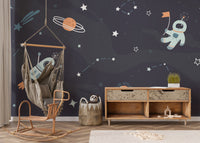 Starry night mural with rockets and stars
