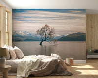 Serene lake poster Alpine environment, delicate tree silhouette, hazy winter light.