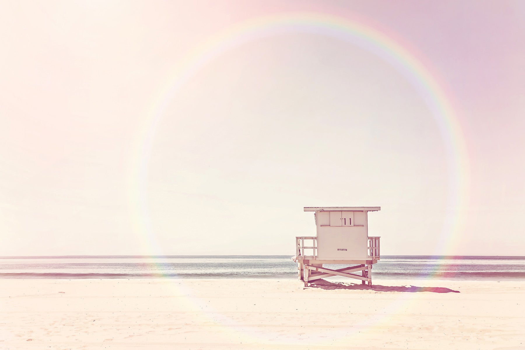 Calm and serene pastel beach scene in wall mural design.

