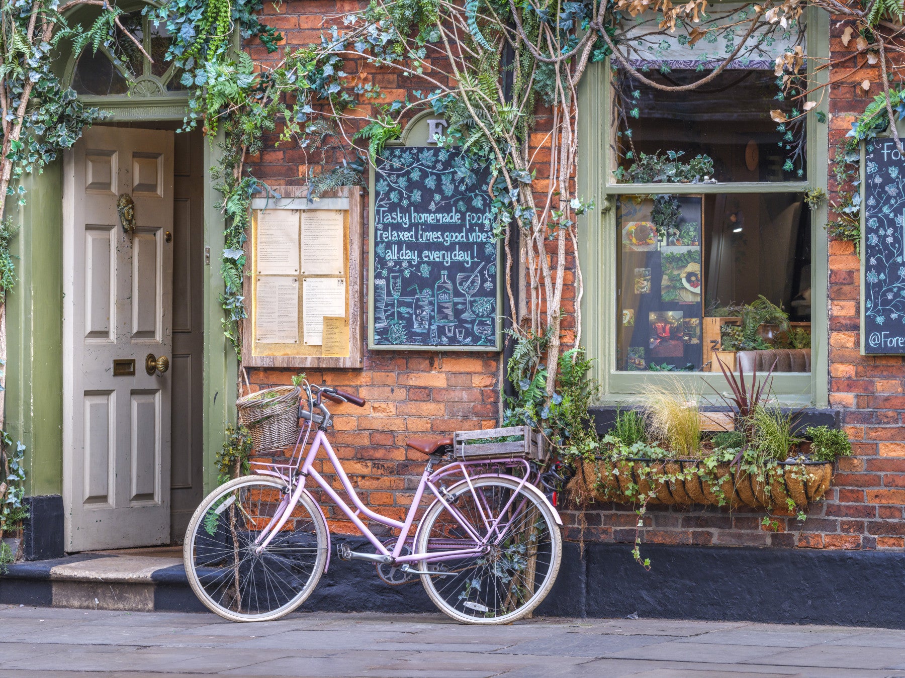 Cozy Cafe with Pink Bicycle Wall Mural in your room — zoomed