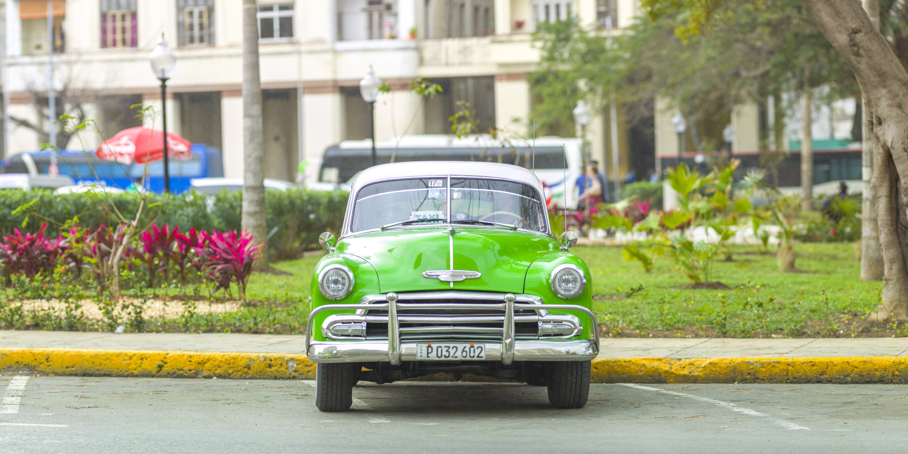 A wall mural of a classic Cuban street scene.

