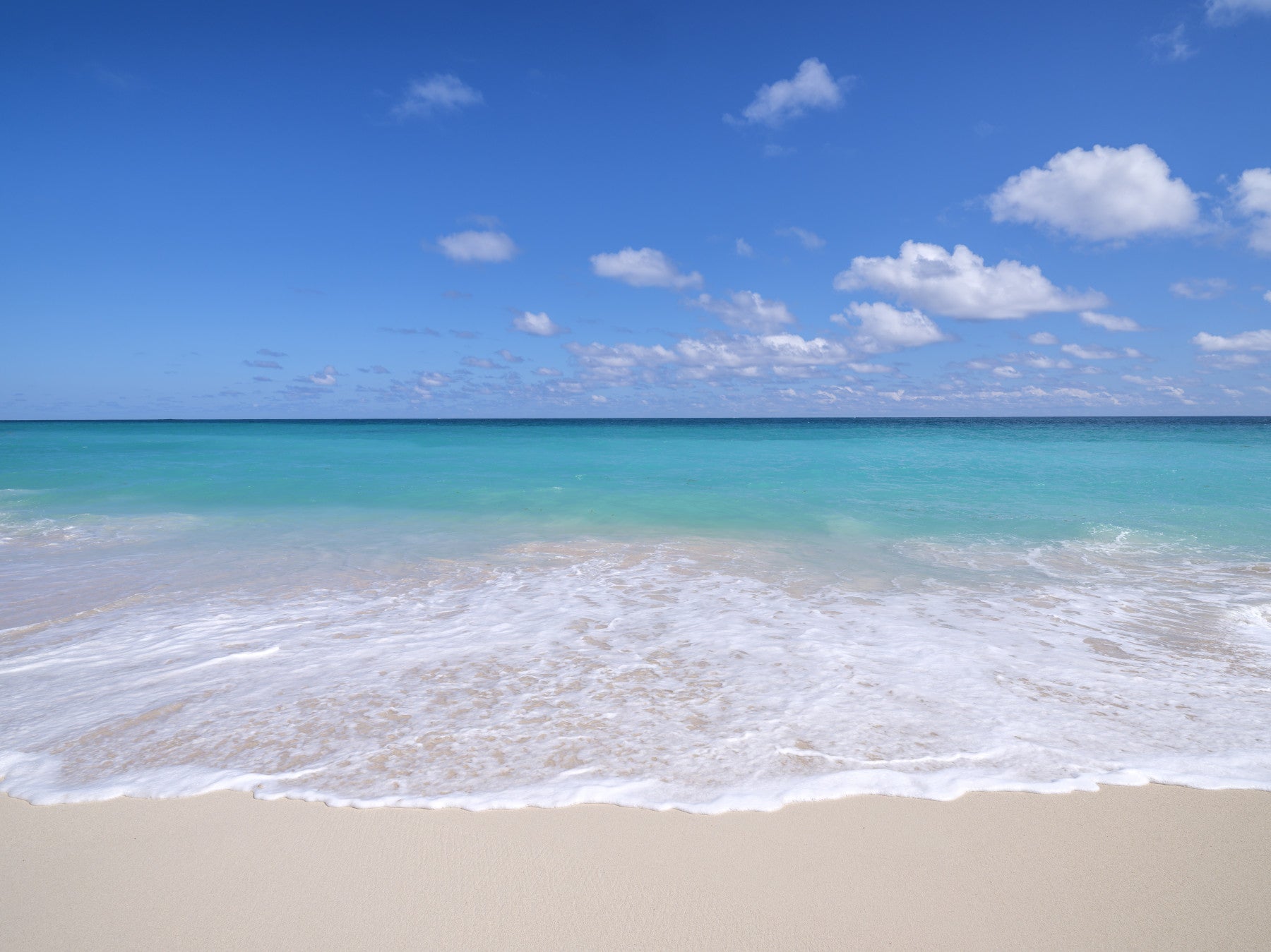 The mural shows a peaceful ocean scene.

