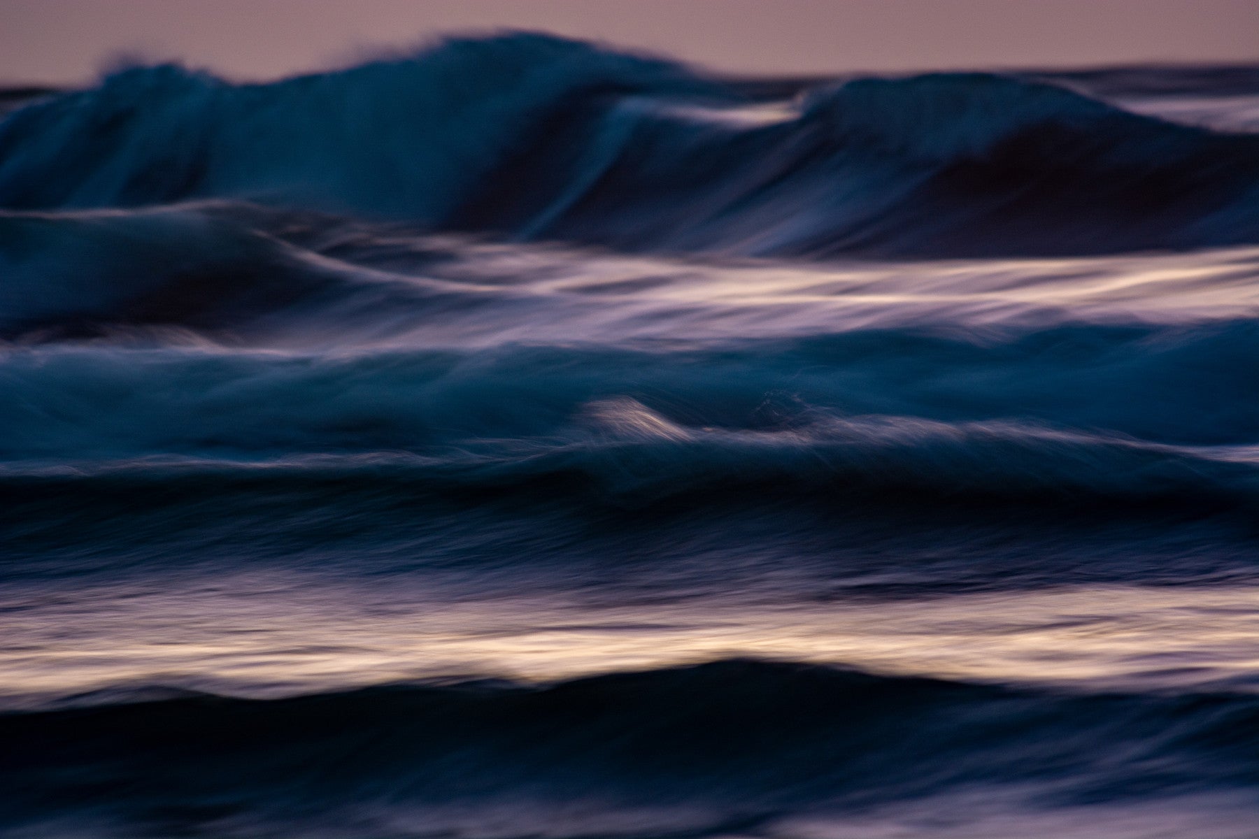 An artistic coastal scene mural on minimalist wallpaper.

