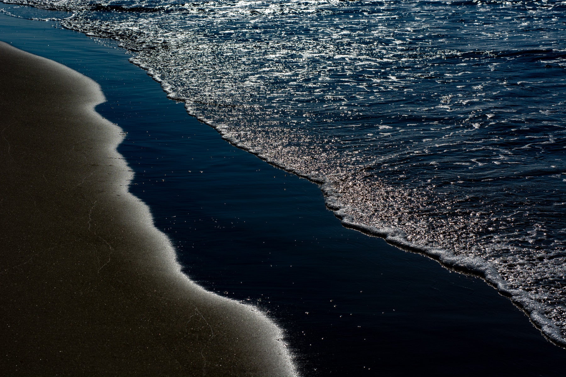A contemplative rocky shoreline wallpaper mural for a feature wall.

