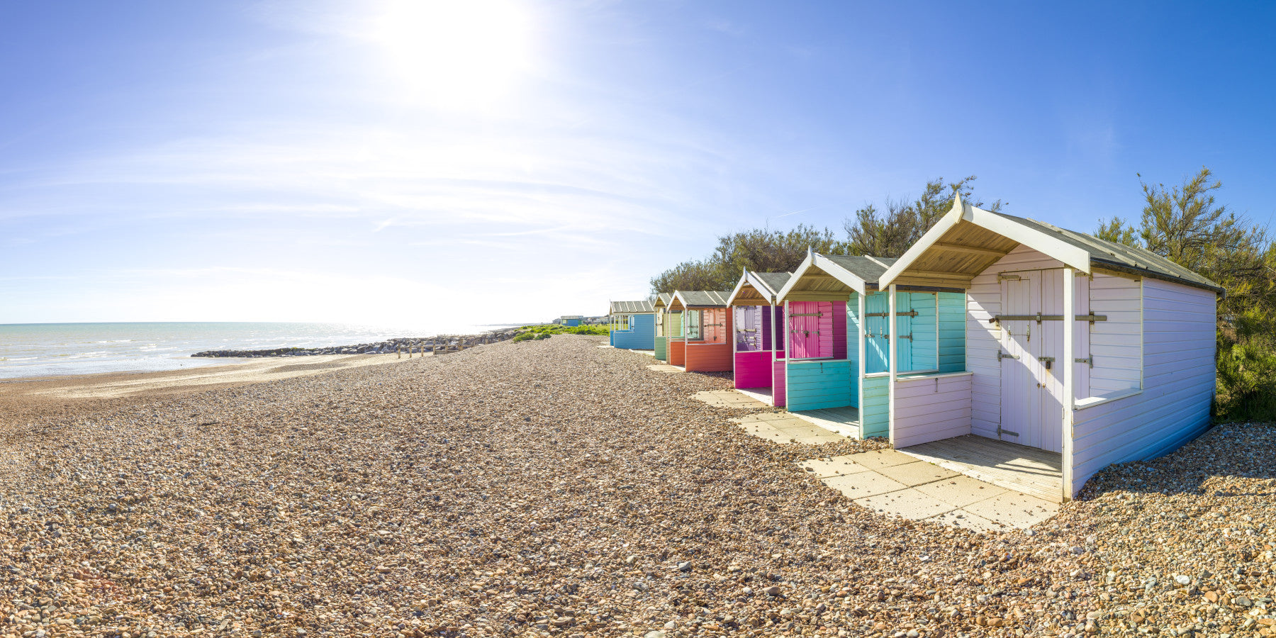 A serene beach hut scene wall mural for your decor.

