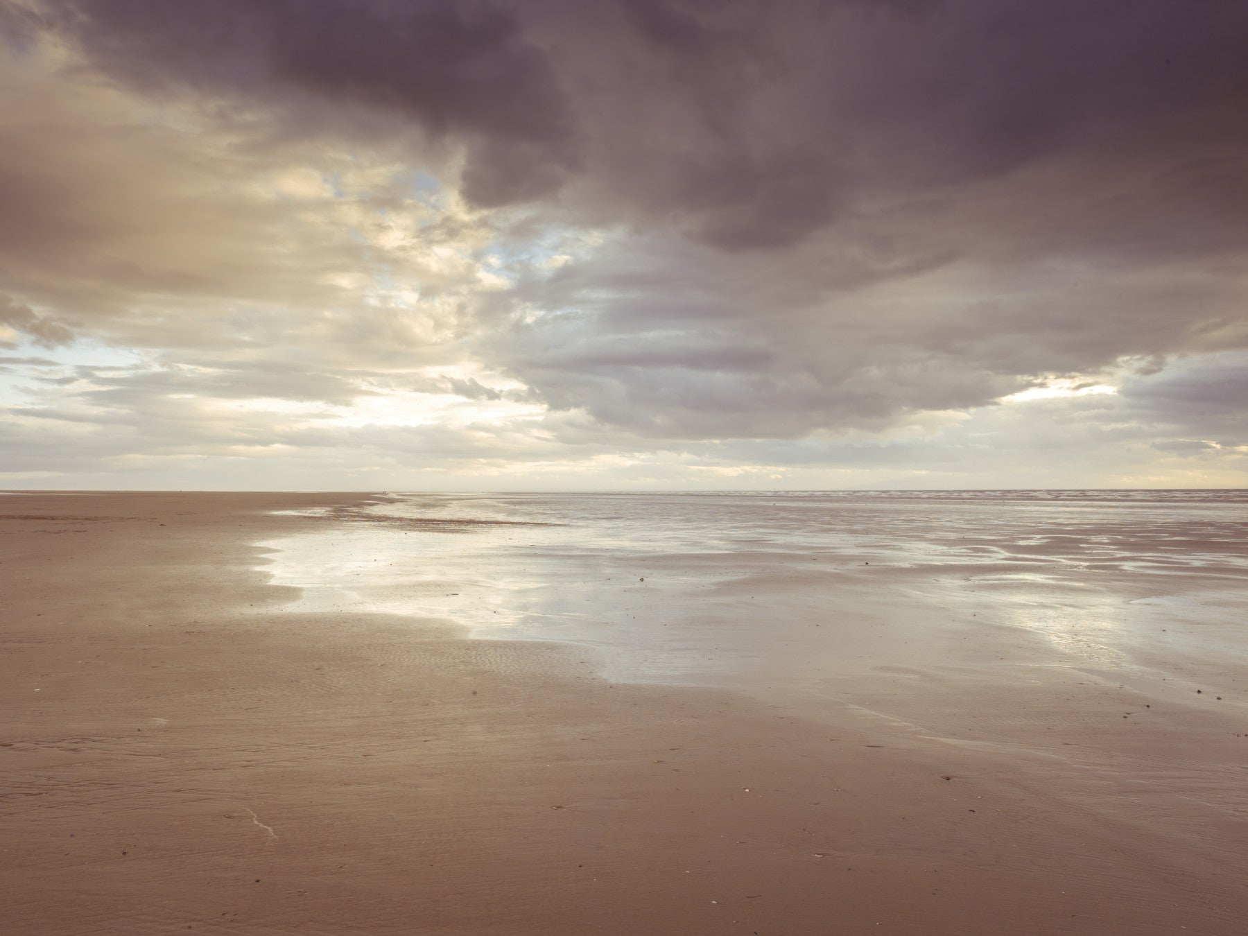 Wet sand reflection captured in Soothing Seashore wall mural for relaxing interiors