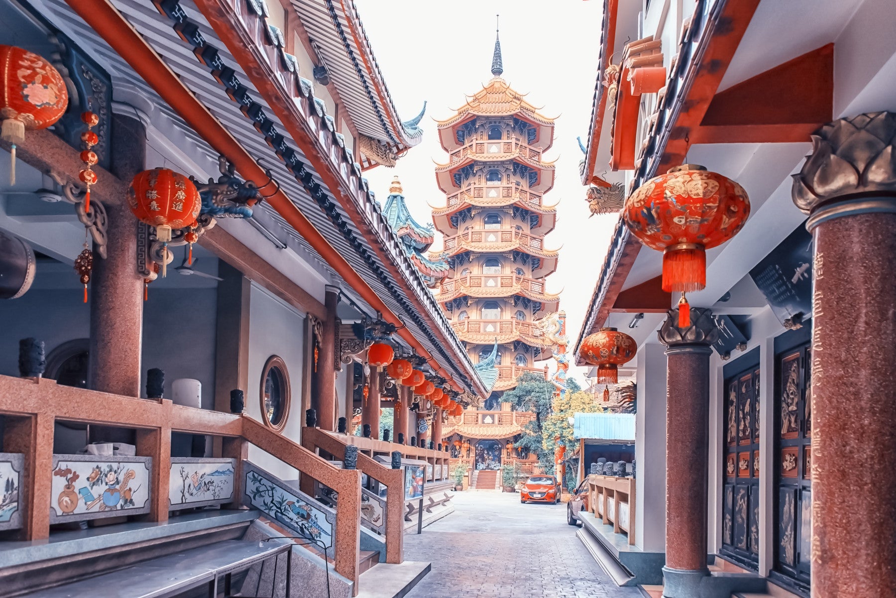 Asian Temple Vista wall mural, tiered pagoda, red lanterns, architectural wallpaper.