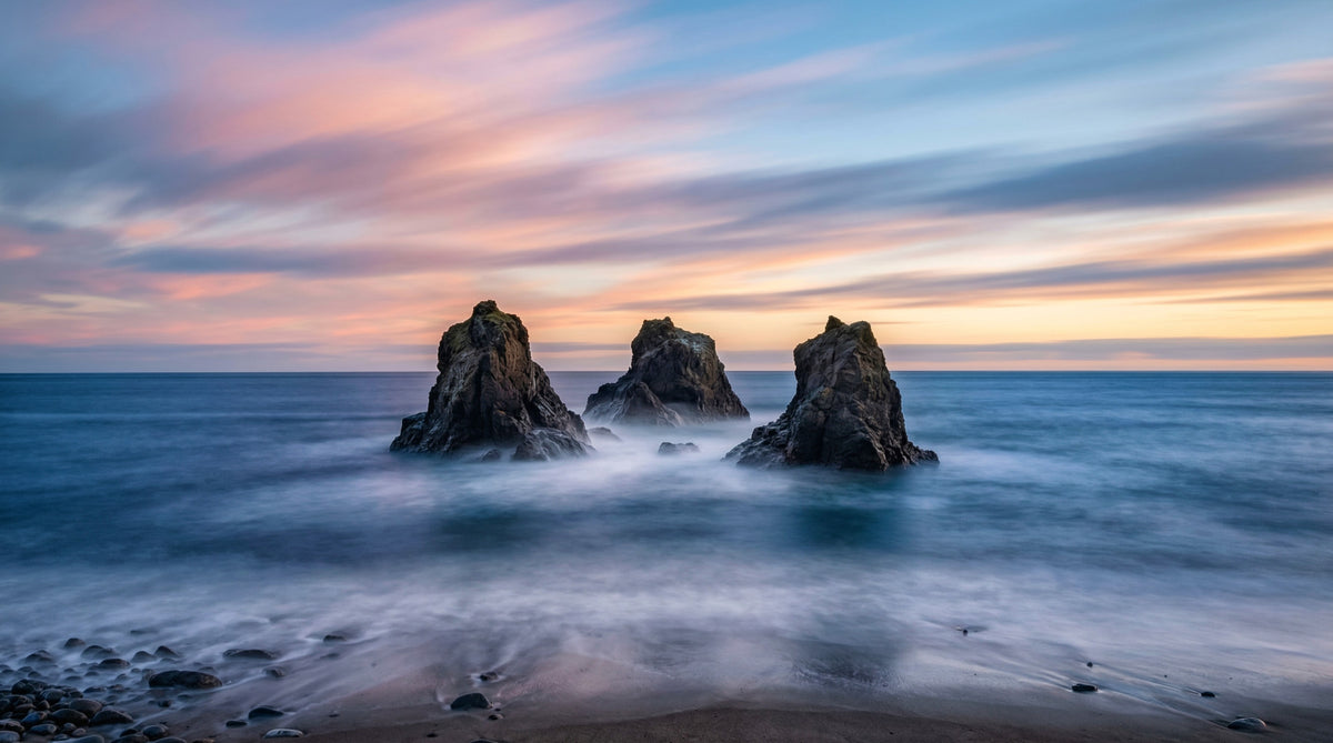 Ethereal Ocean Rocks at Sunset Wall Mural in your room