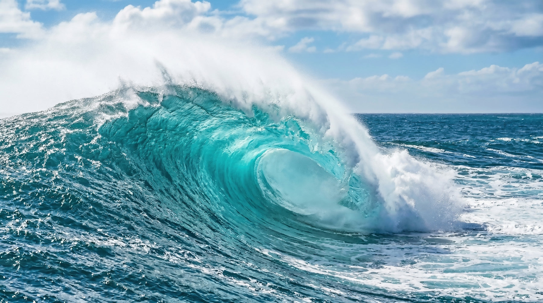 Turquoise wave wall mural in a lounge area  