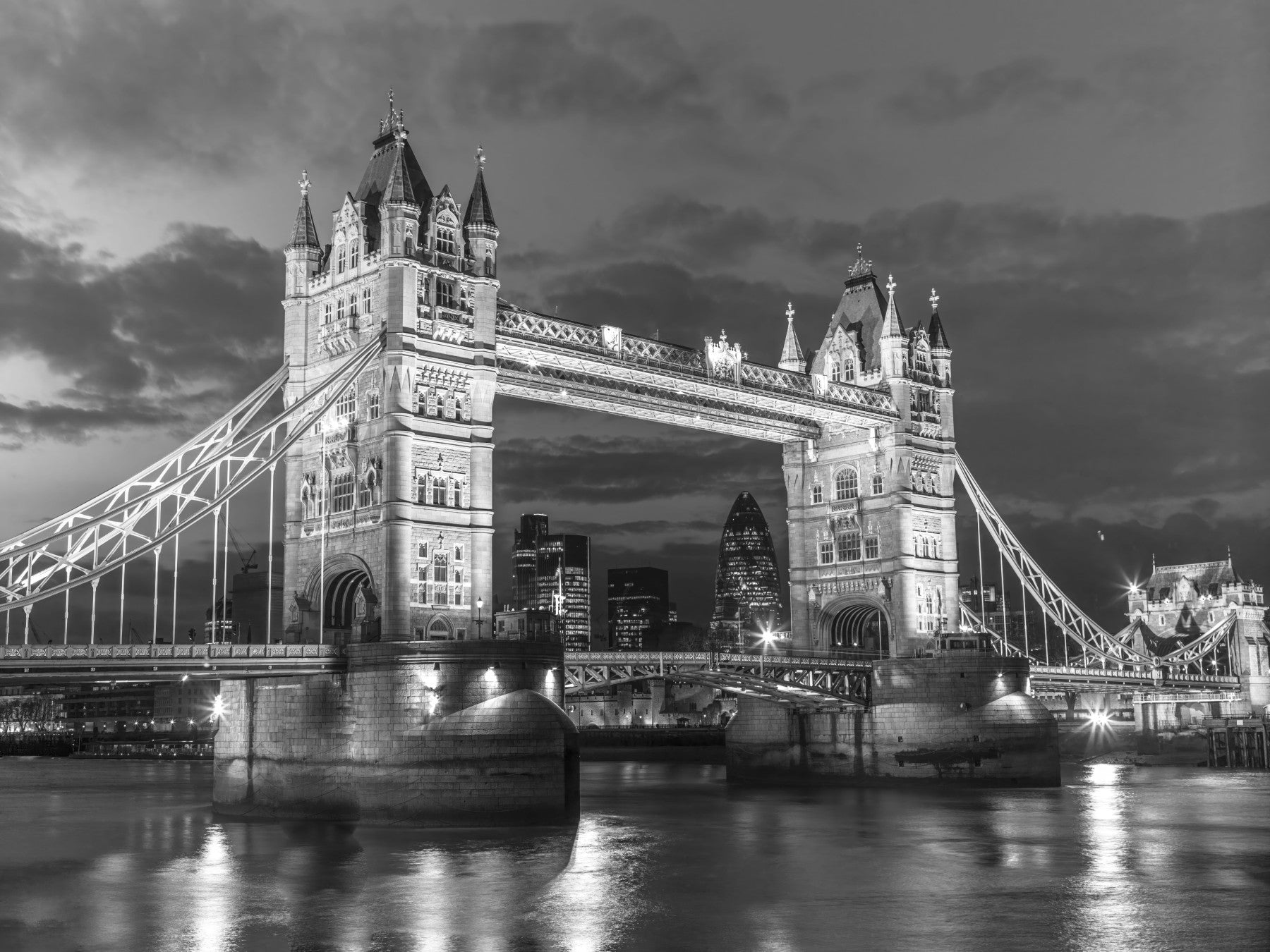 Tower Bridge Glow wall mural anchors a calm living room with monochrome drama