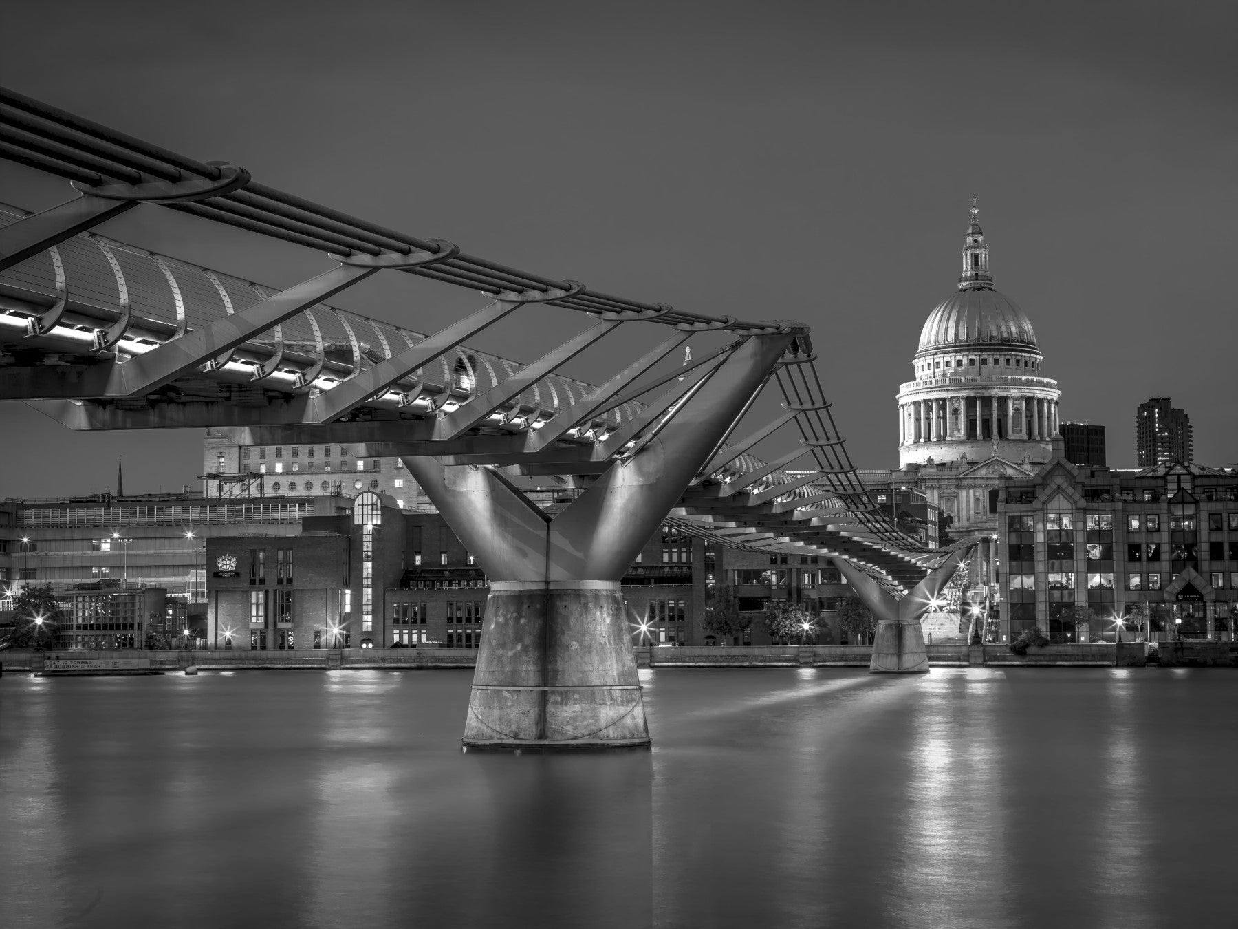 St Paul's dome rises beside a Café through this Millennium Bridge wall mural.