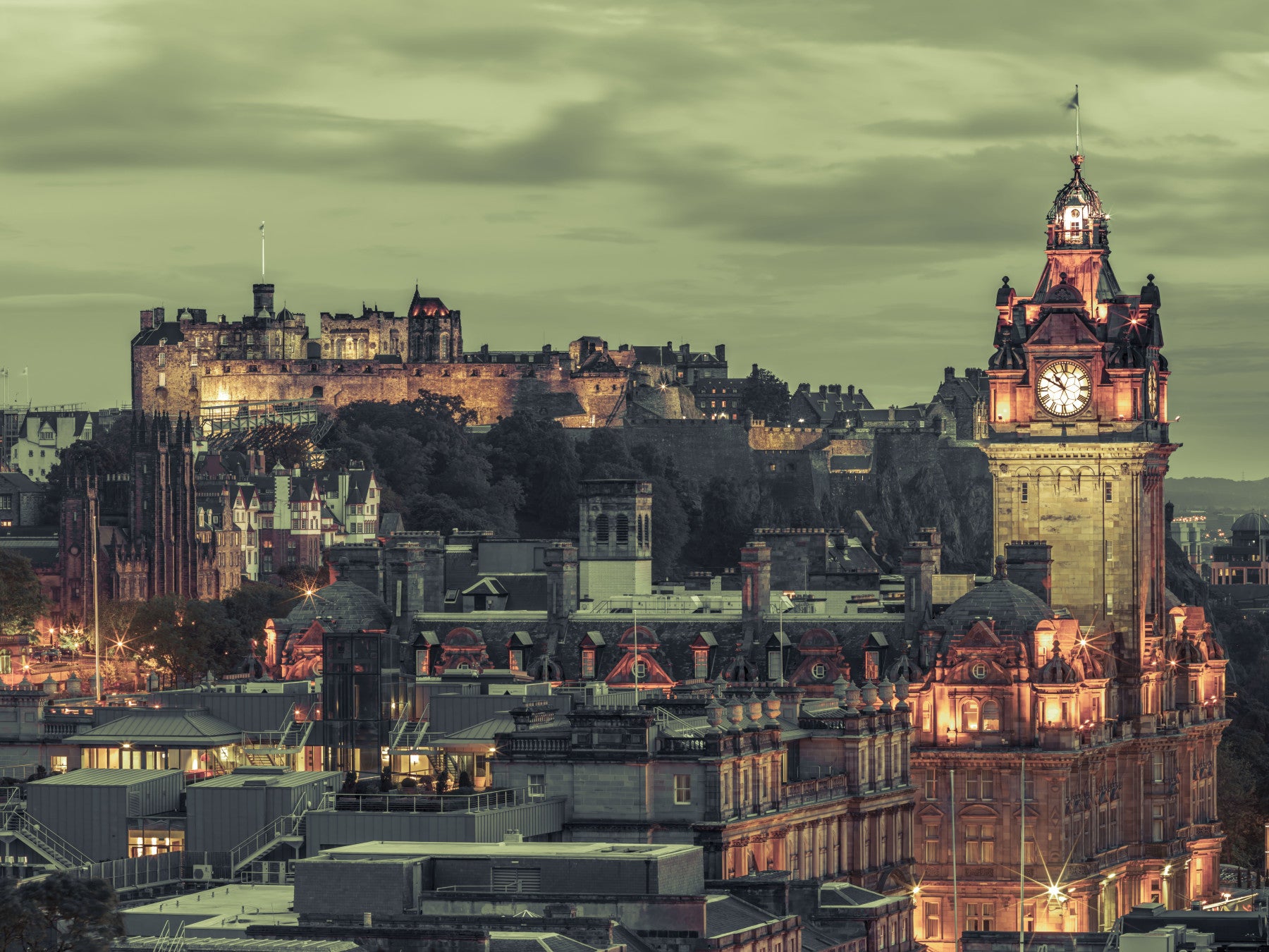 Edinburgh evening glow lifts a Dining room, the Castle & Clock Tower wall mural ahead.