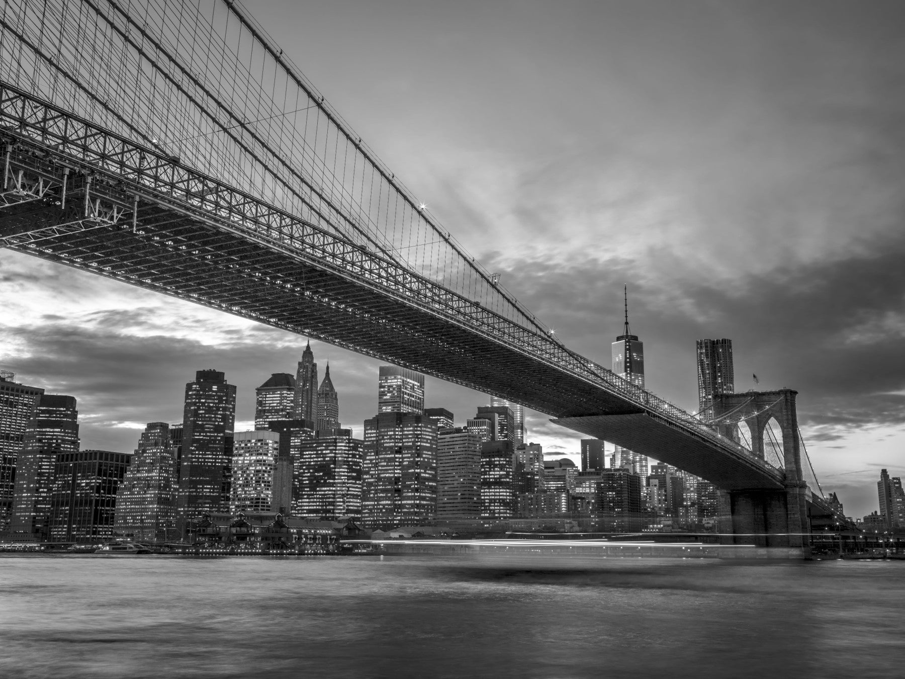 Brooklyn Bridge looms above the Living room within the Iconic NYC wall mural
