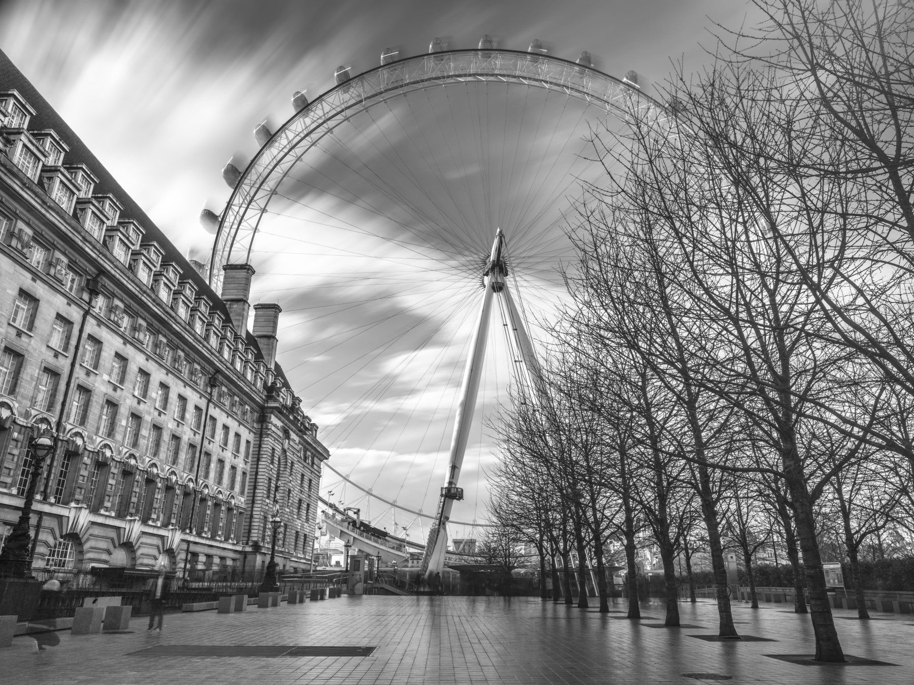A dining table sits before the London Eye Monochrome Majesty wall mural.