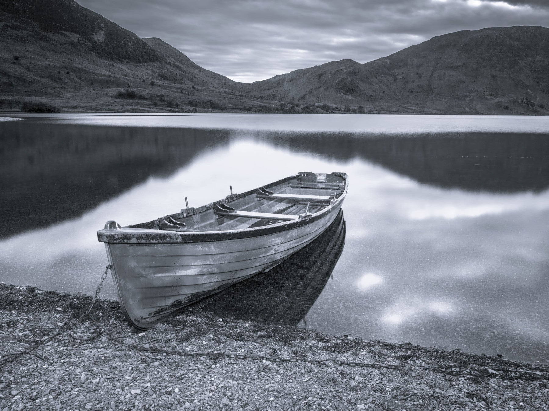Lake-boat scene from Silent Waters fills the living room as a wall mural backdrop.