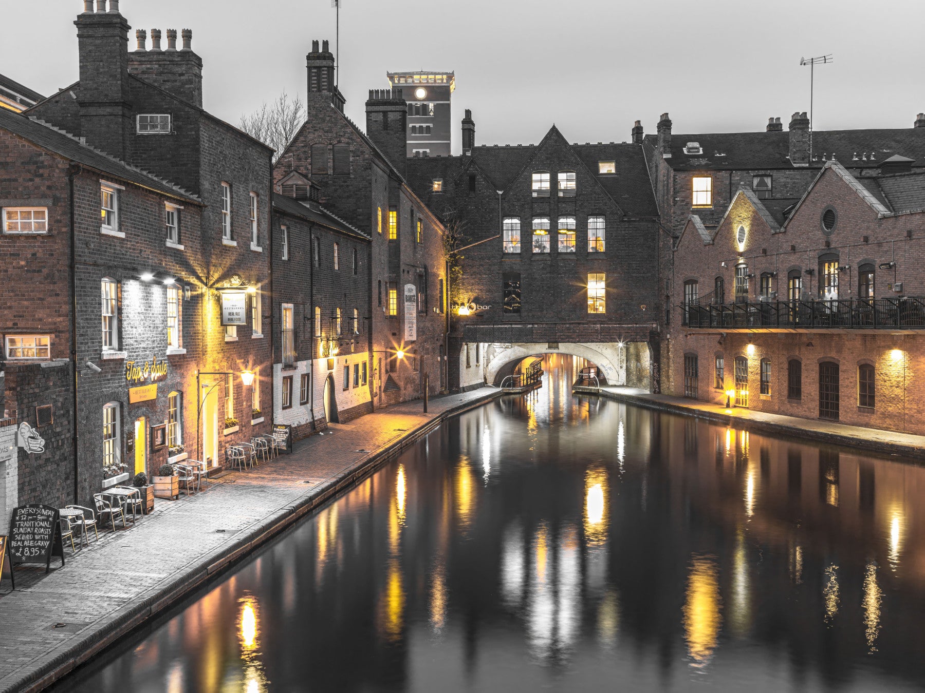 Brick rooftops and lit windows from the Canal Twilight wall mural calm a Living room