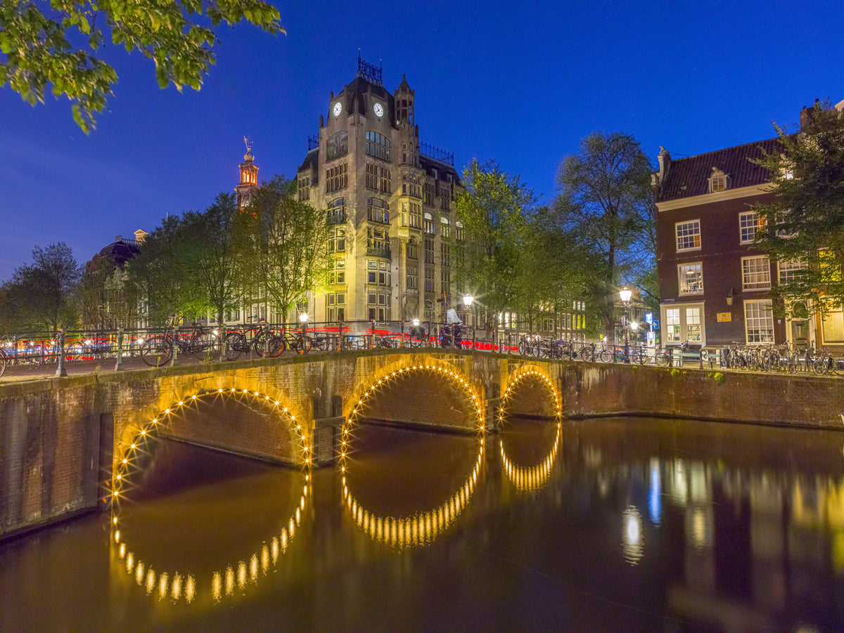 Canal through Amsterdam city Wall Mural in your room
