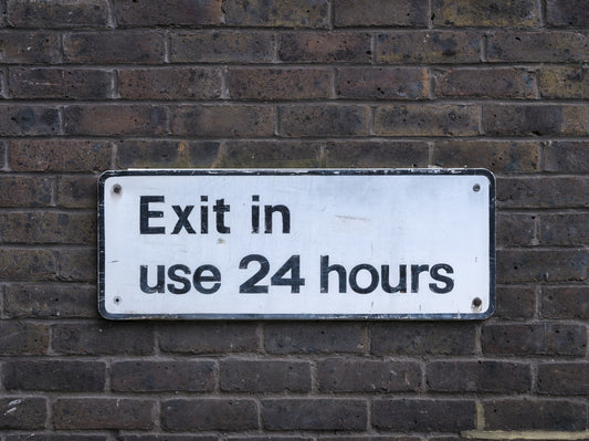 Weathered Exit on Textured Brick Wall Mural