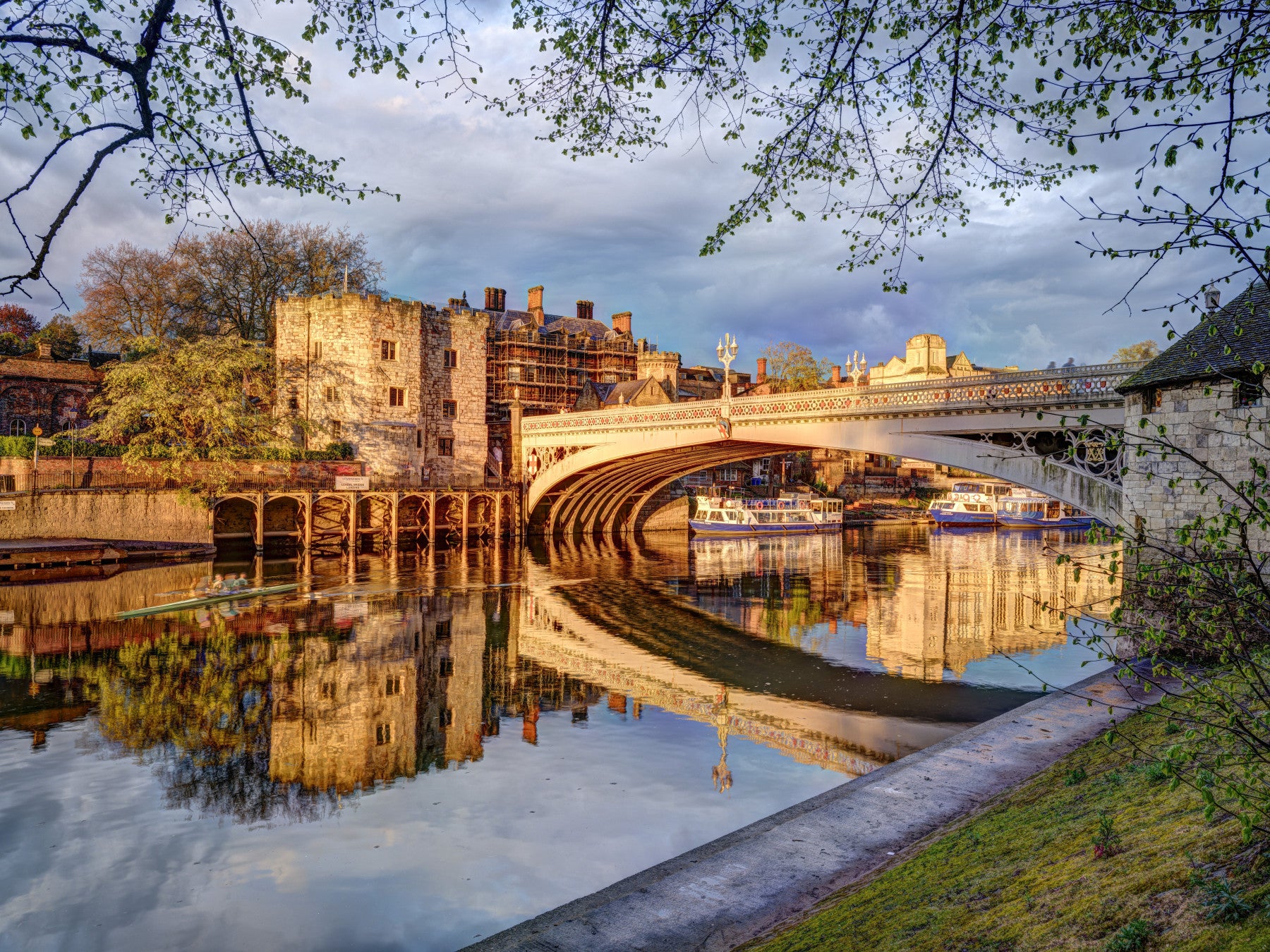 York riverside wall mural with golden reflections on calm water