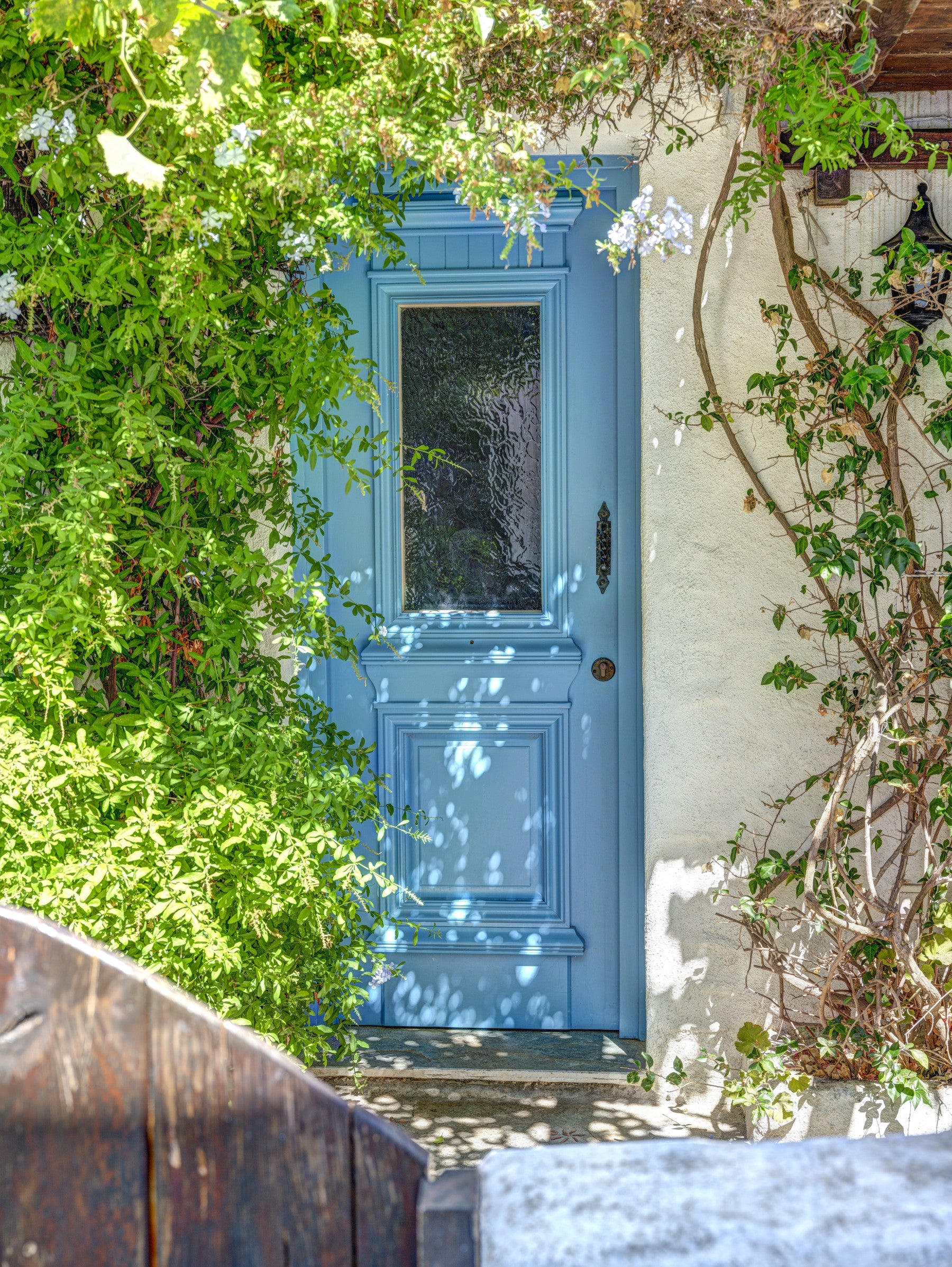 Azure doorway wall mural with blue door and textured 