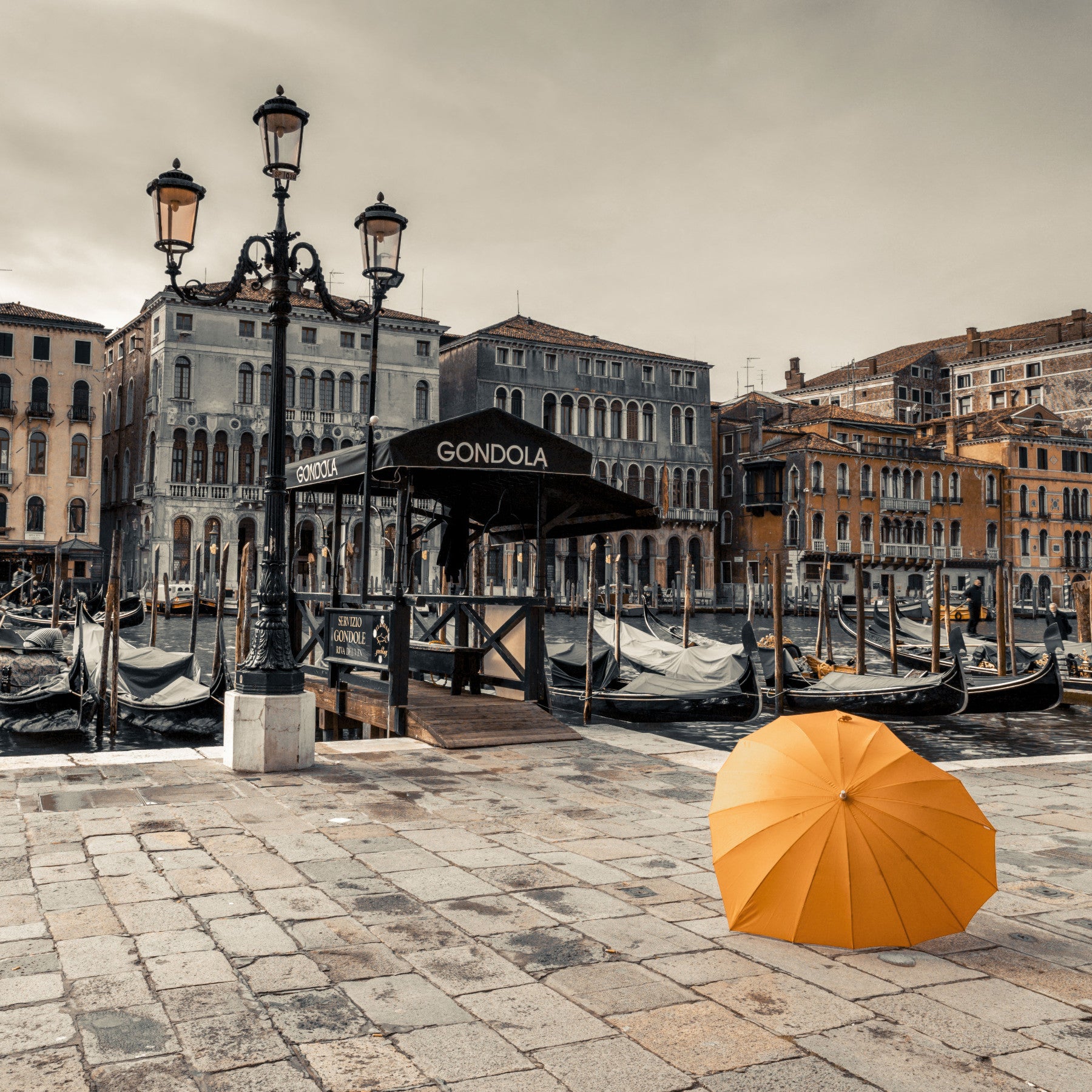 Serene Venice Canal with Orange Umbrella Wall Mural