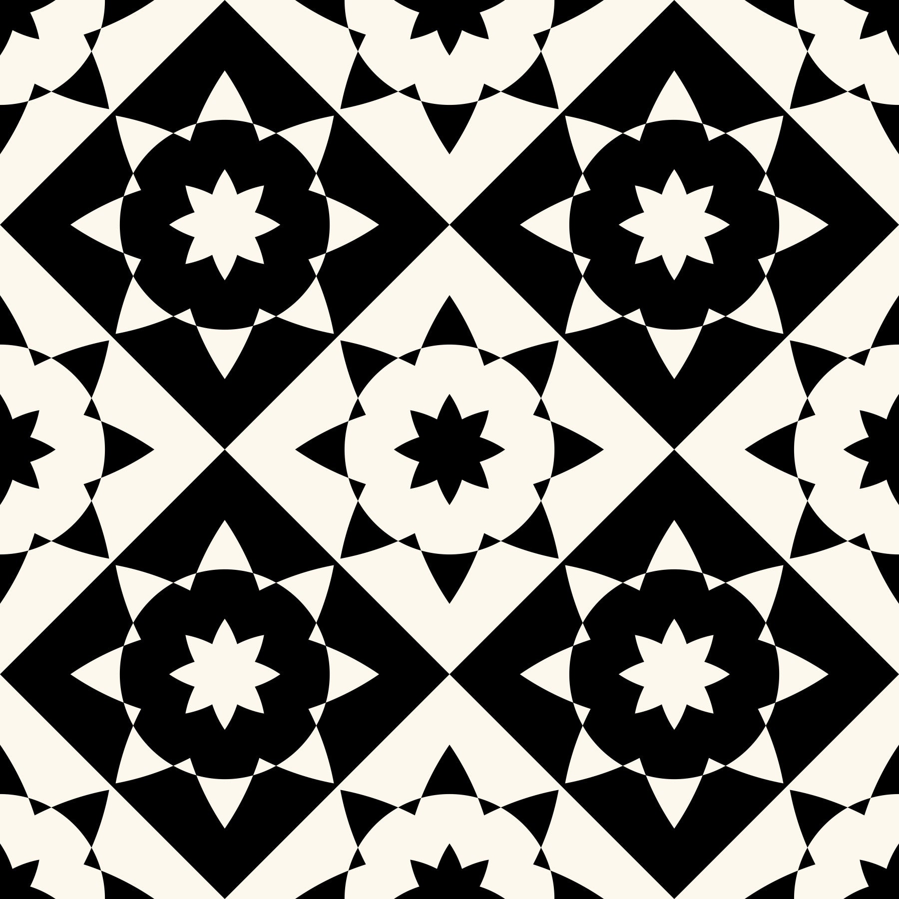 Black and cream geometric starburst wallpaper in a living room with white wicker chairs GD12503