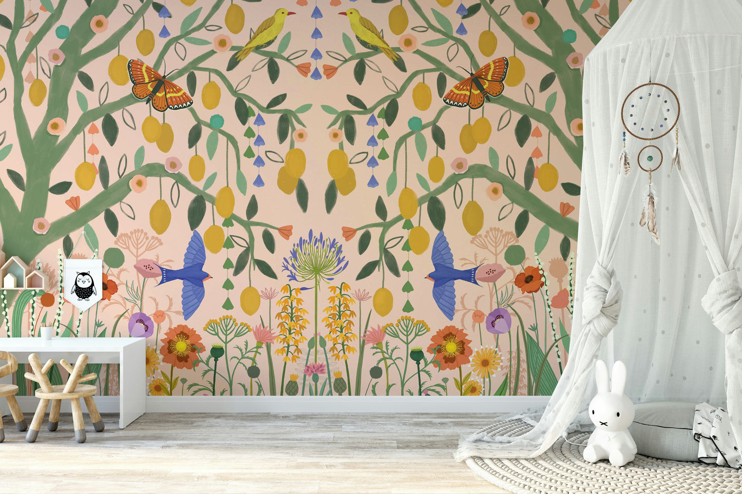 Fresh citrus tree wallcovering for a nursery with organic cotton textiles and timber toys.
