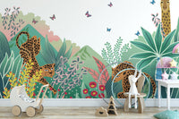 Leopard and Giraffe Kids wallpaper mural with a colorful jungle behind a toy pram in a kids room