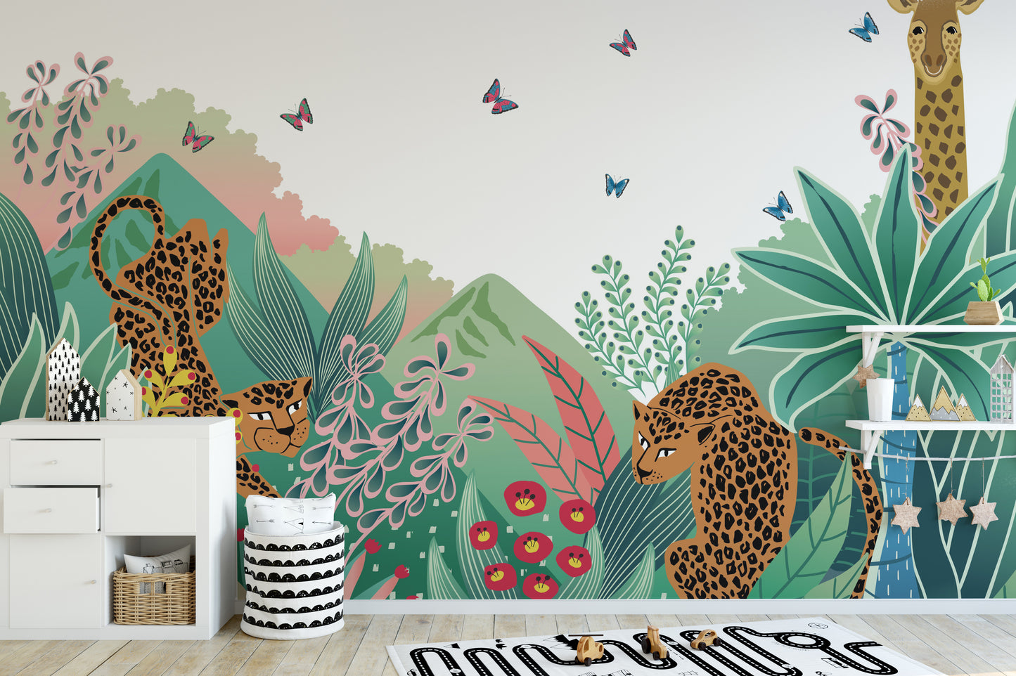 Leopard and Giraffe Kids wallpaper mural with leopards and a giraffe beside a white dresser in a kids room