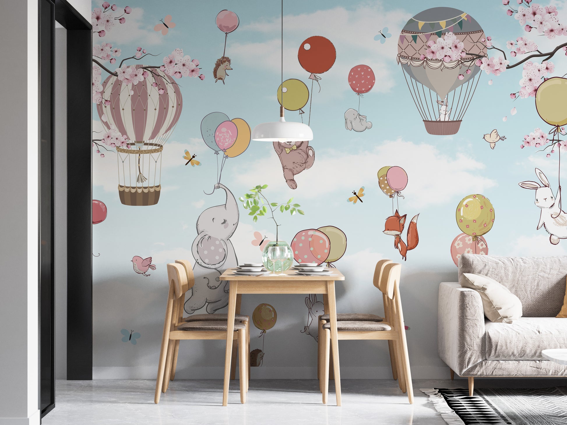 Levitating animals wallpaper mural styled as a living room feature wall behind a sofa and seating in soft pastel tones