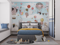 Levitating animals wallpaper mural styled as a feature wall behind a dining table and chairs in soft pastel tones