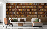 Library Bookcase wallpaper mural of wooden shelves full of books behind a white sofa and orange accent chair