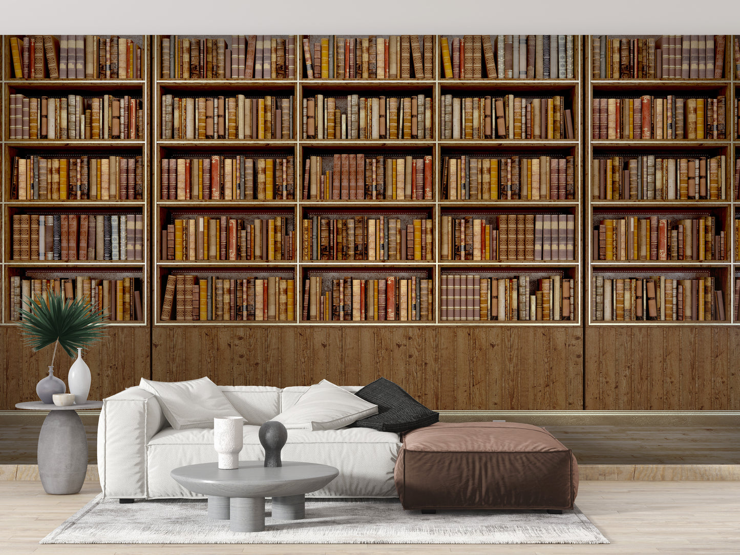 Library Bookcase wallpaper mural of stacked books behind a white sofa and brown leather ottoman