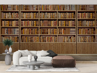 Library Bookcase wallpaper mural of stacked books behind a white sofa and brown leather ottoman