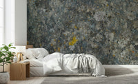 Decorative mural featuring textured rocks with natural lichen and moss patterns.