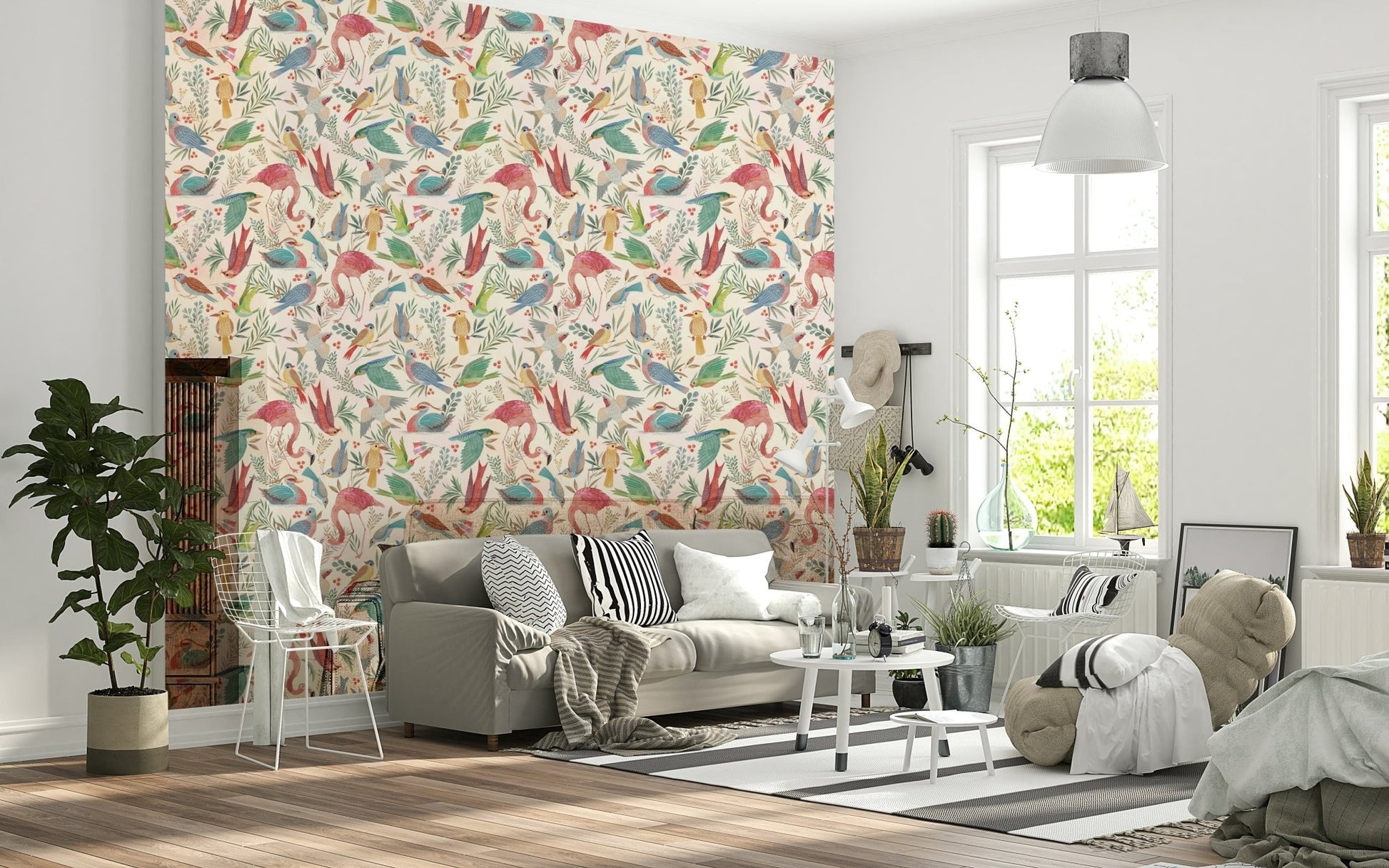 light Birdwatcher's wallpaper of pastel birds and leaves above a grey sofa with striped pillows in a living room