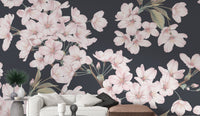 Soft pink floral wallpaper on a dark backdrop
