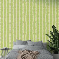 Playful lime green pebble pattern wallpaper for modern interiors

