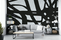 The room feels dramatic and chic due to the dark, elegant design.

