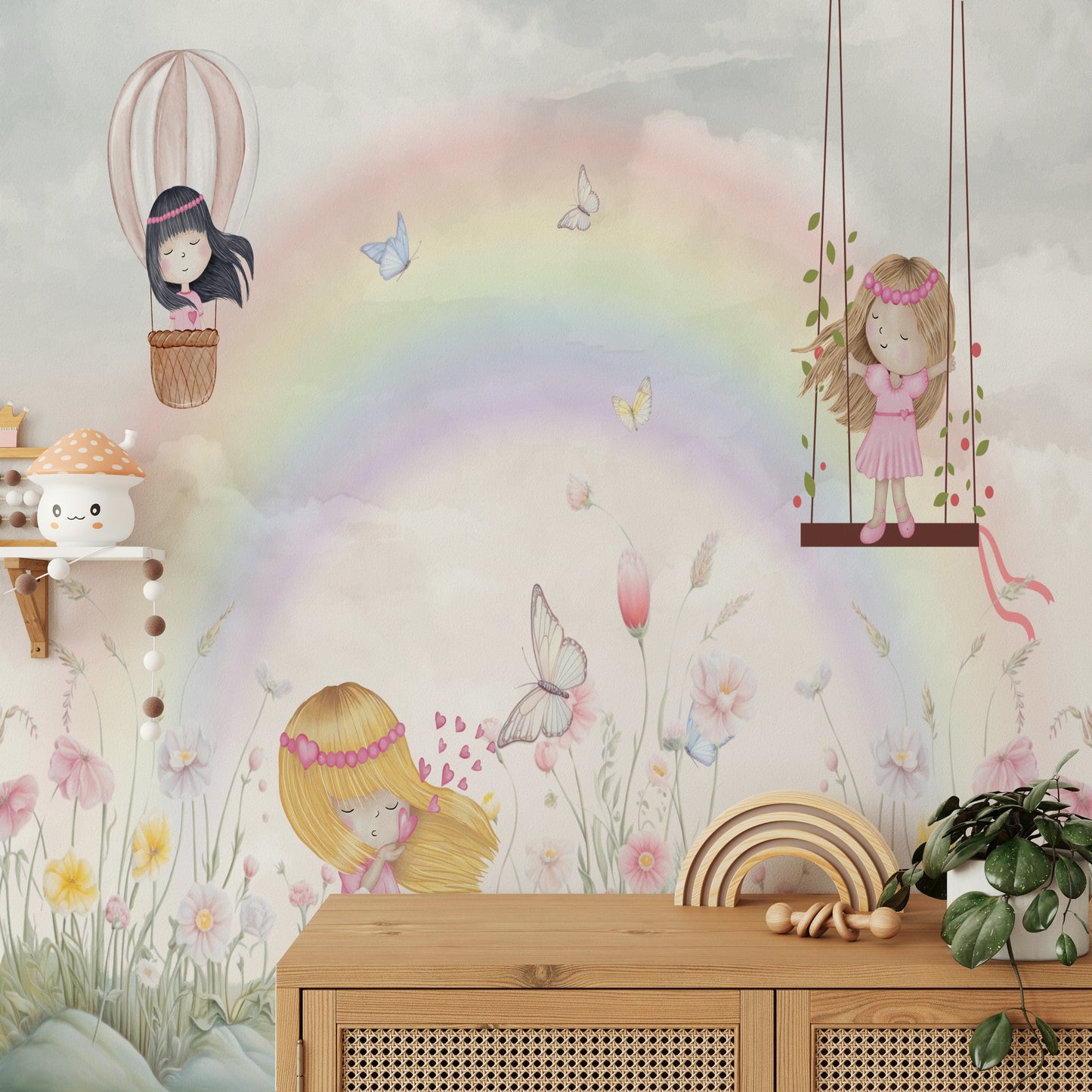 Little Girls Adventures wall mural with a watercolor rainbow above a wood sideboard with a wooden rainbow toy