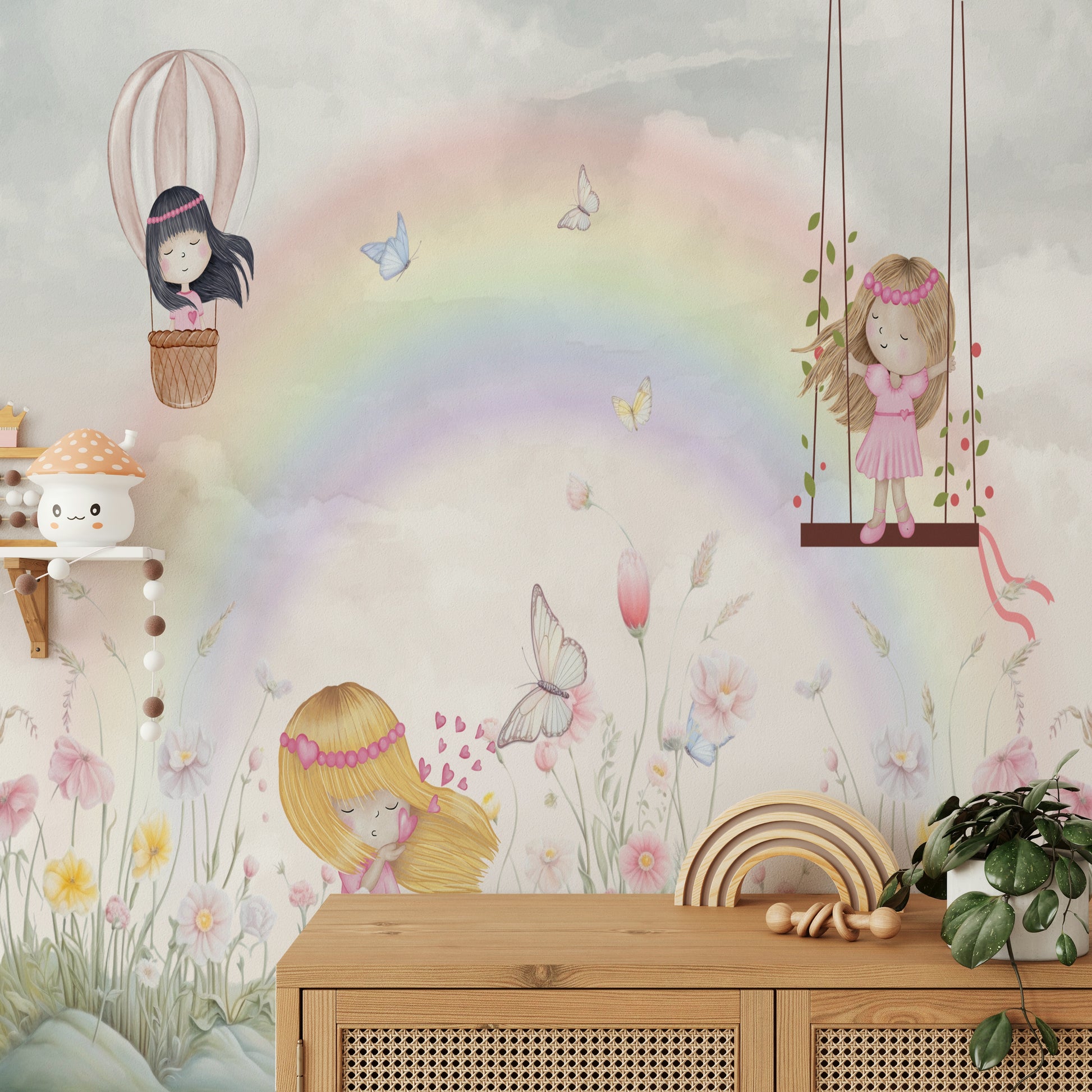 Little Girls Adventures wall mural with a watercolor rainbow above a wood sideboard with a wooden rainbow toy