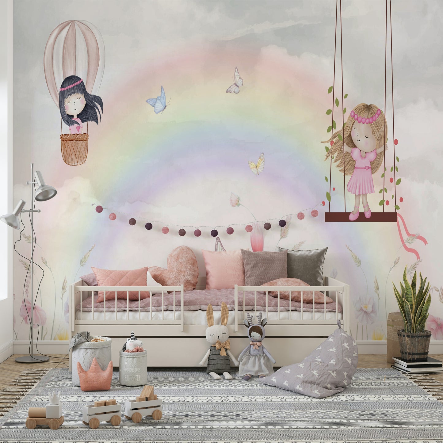 Little Girls Adventures wall mural of a rainbow and swinging girl above a cream daybed with pink pillows