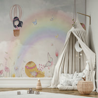 Little Girls Adventures wall mural of a rainbow and butterflies beside a beige canopy teepee in a kids room