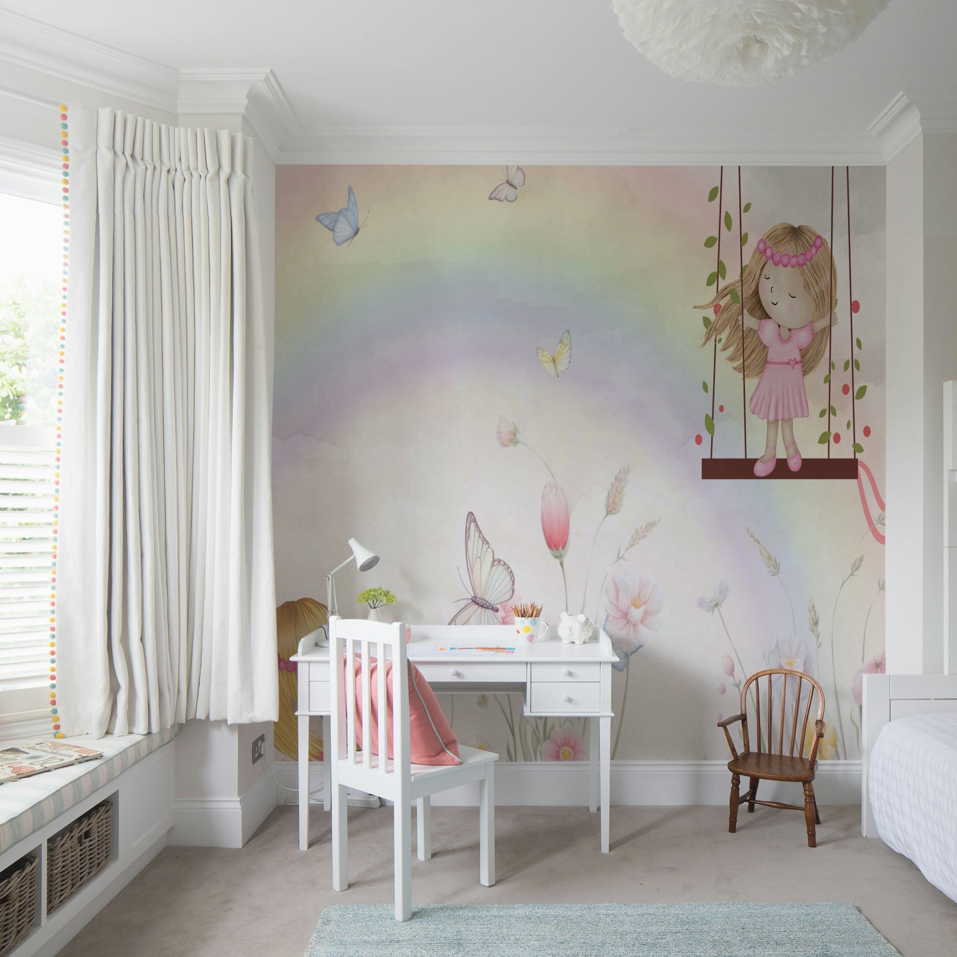 Little Girls Adventures wall mural with a pastel rainbow behind a white desk and chair in a bright girls room