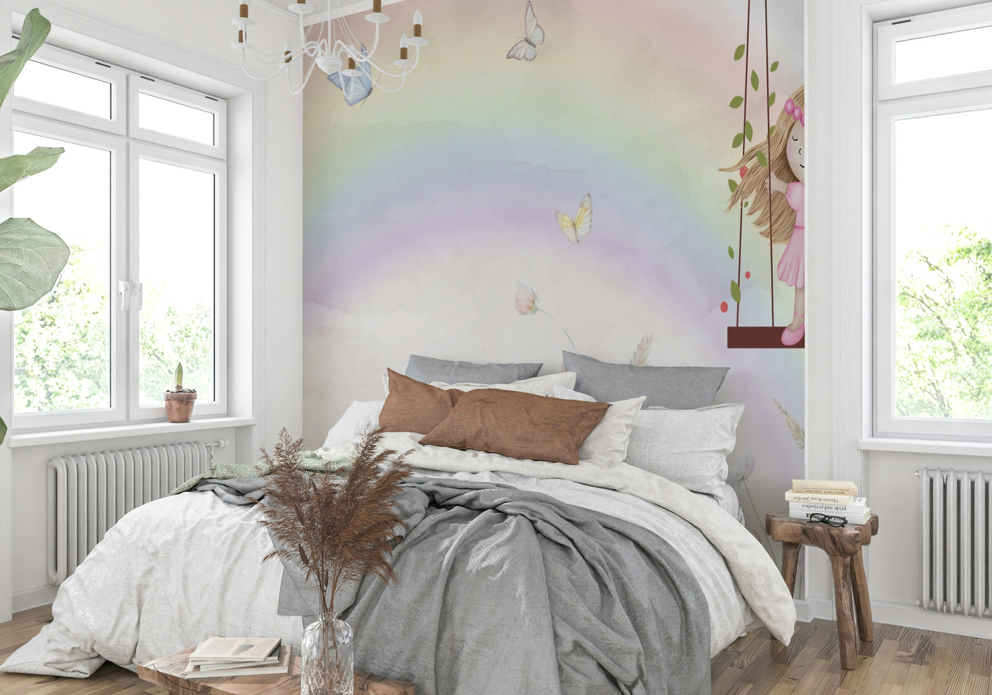 Little Girls Adventures wall mural with a pastel rainbow behind a gray bed and rust pillows in a bright bedroom