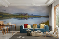 A wall mural of a serene loch surrounded by hills.

